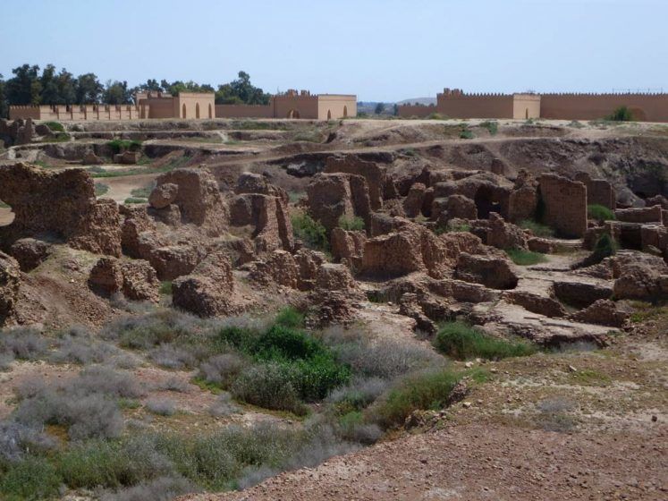 Old eroded stone ruins set into the ground.