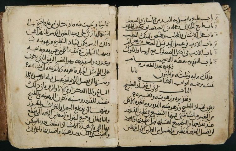 An open book showing Arabic text