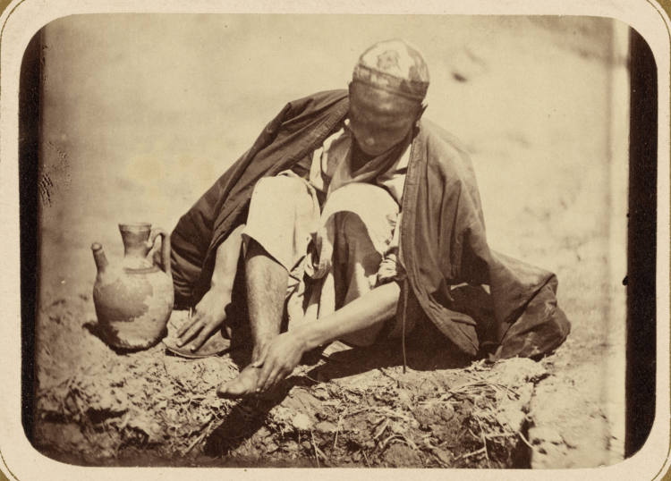 A picture of a Muslim performing ritual wudu, or washing before prayer (circa 1865).